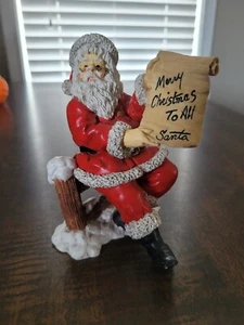 WEIHNACHTSMANN Weihnachten Keramik Figur Weihnachtsmann sitzend auf Zaun Frohe Weihnachten - Bild 1 von 6