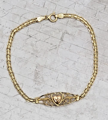 Brazalete Cuerda Filigrana Oro Amarillo 14K con Centro Corazón Oro Rosa Foto 1 de 4