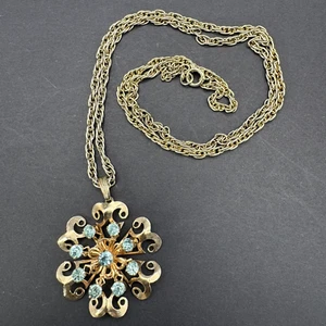 Vintage Gold Tone Starburst Open Work Flower Pendant Necklace Blue Rhinestone - Picture 1 of 8