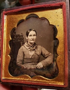 Sixth plate daguerreotype of woman sitting for her portrait with great brass mat - Picture 1 of 1