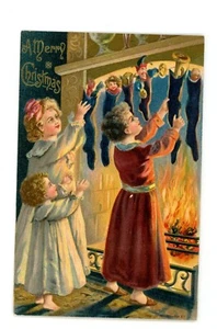Medias colgantes vintage antiguas postal Navidad niños por chimenea - Imagen 1 de 3