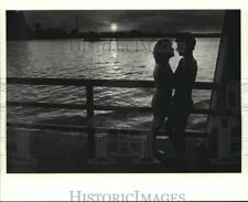 1987 Press Photo A silhouette of couple in a ferry - nob09216