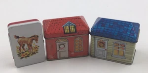 Zwei Blechhäuser, die Kerzen sind und eine Pferdedose - Bild 1 von 2