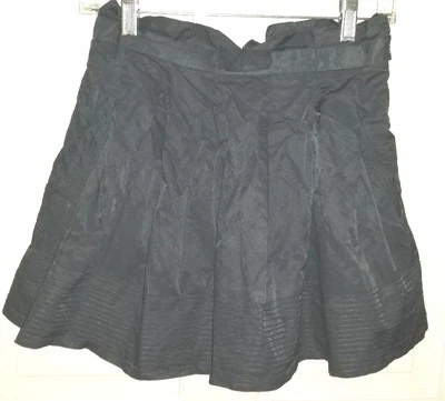 BEBE minifalda plisada gris oscuro completa bolsillo lateral corto. 2 Foto 1 de 4