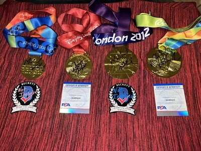Juego de 4 réplicas de medallas de oro firmadas por Michael Phelps Atenas, Beijing, Londres y Río Foto 1 de 4