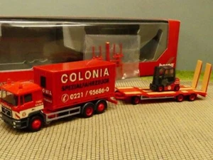 1/87 Herpa MAN F90 Colonia mit Goldhofer TU3 und Gabelstapler 308182 - Bild 1 von 2