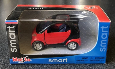 2005 Maisto Smart Car Motorized 1:33 Scale Pull Back Red & Black Diecast Car - Image 1 of 4
