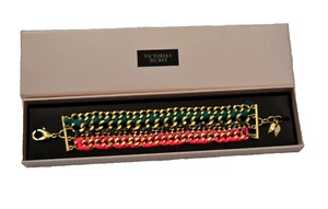 Victoria's Secret Armband rosa/blaugrün gewebt goldfarben neu im Karton 6 3/4" L - Bild 1 von 6