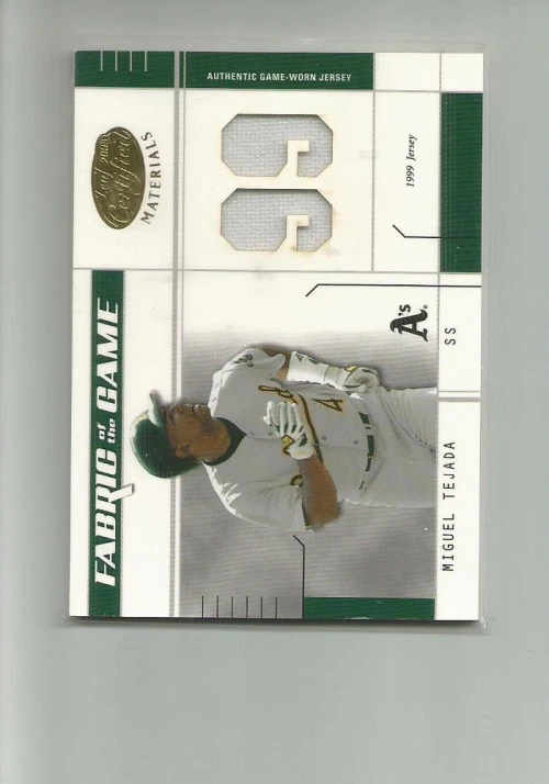 2003  CERTIFIED MATERIALS FABRIC OF THE GAME #19JY MIGUEL TEJADA  JERSEY  50/99 - Image 1 of 2