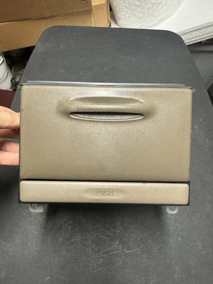 Toyota Corolla 1998-2002 tablero central cubo de almacenamiento cubby portavasos marrón OEM Foto 1 de 4