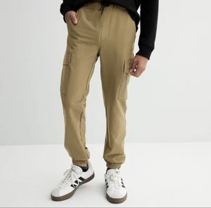 Pantalones de chándal Hollywood para niños talla 8 Performance negros con bolsillos con cremallera nuevos con etiquetas sin abrir - Imagen 1 de 7