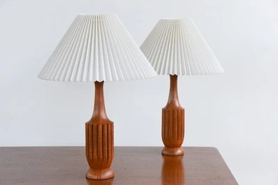 Heritage pair of teak table lamps with new white pleated lampshades - Image 1 of 4