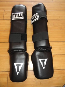 1 PAIR TITLE MMA Boxing Vinyl Shin-Instep Guards 2.0 ADULT UNISEX LARGE - Picture 1 of 8