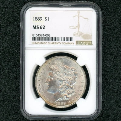 Gold Toning Reeding! 1889 1$ Morgan Silver Dollar MS-62 NGC Rare 100% Pure Ounce - Image 1 of 4