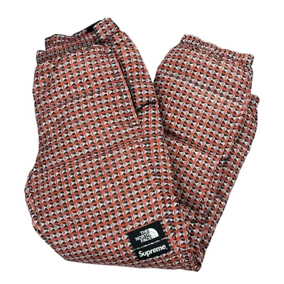 Pantalones SS21 Supreme The North Face rojos tachonados estampados puffer nuptse talla pequeña Foto 1 de 4