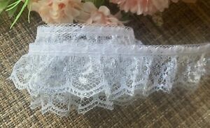 1 inch wide ruffled lace white/silver iridescent selling by the yard