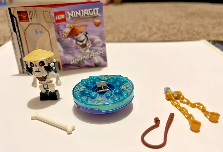 LEGO NINJAGO WYPLASH MINI FIGURE SPINNER & WEAPONS USED - Image 1 of 4