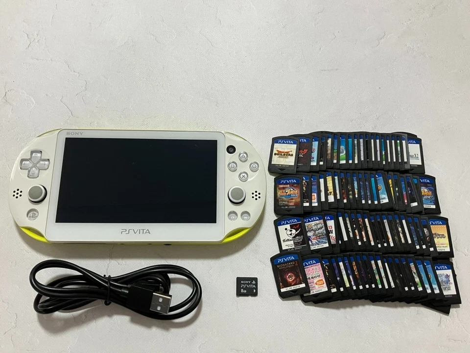 Sony PS Vita PCH-2000 Console with charger / Memory card random 2 games from US - Image 1 of 4