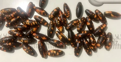 Cuentas negras ovaladas con manchas naranjas/rojas-suministros de joyería artesanal sudafricana Foto 1 de 2
