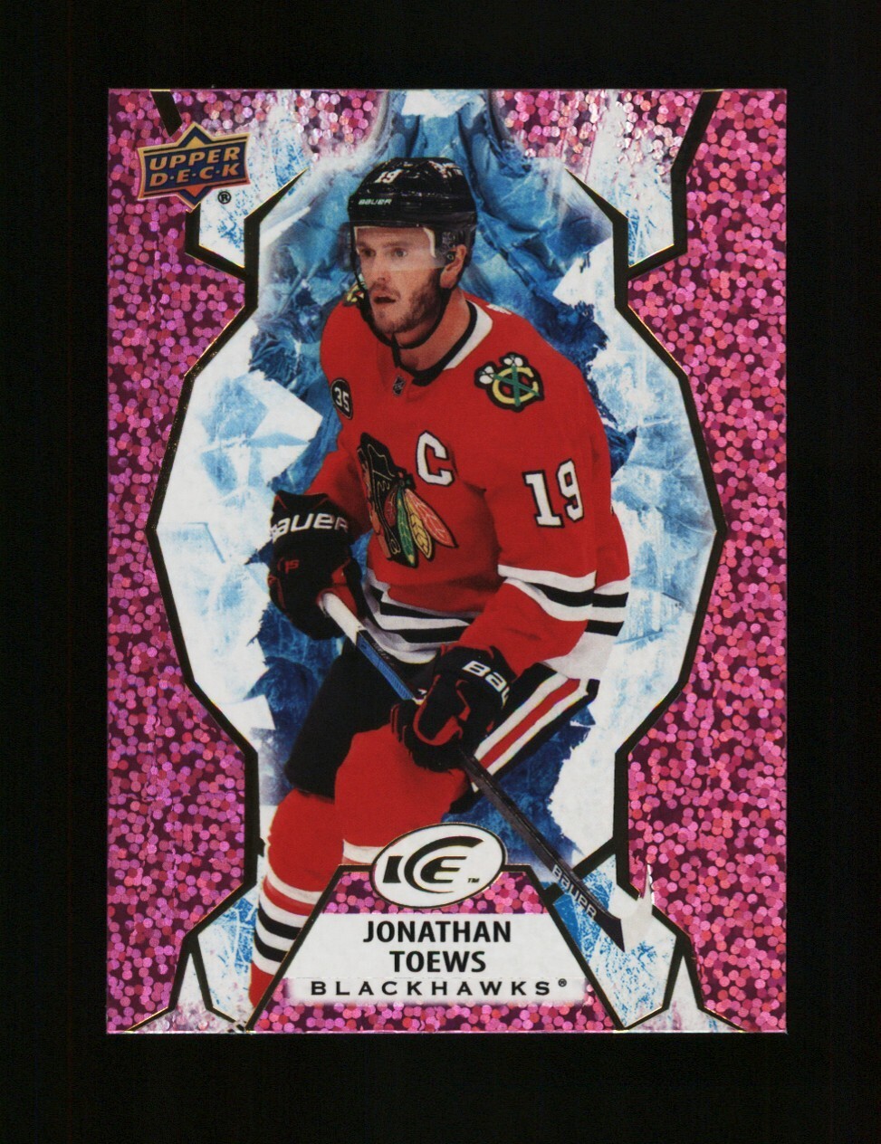 2021-22 UD Ice Base Lavender #64 Jonathan Toews - Chicago Blackhawks