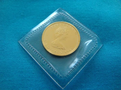 Moneda de $5 hoja de arce de oro Canadá 1985 1/10 oz 0,9999 fino BU plástico como nuevo #85 ml33 Foto 1 de 4