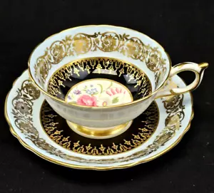 Taza de té y platillo Paragon porcelana negro dorado con centro de ramo de rosas florales - Imagen 1 de 14