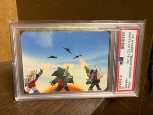 1985 Hasbro Transformers #152 Dinobots vs. Decepticons PSA 8 - Bild 1 von 2