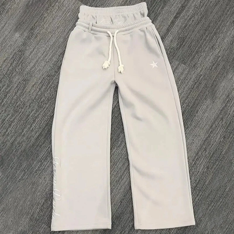 Pantalones falsos de dos piezas pantalones sueltos con cordón bordados Foto 1 de 4