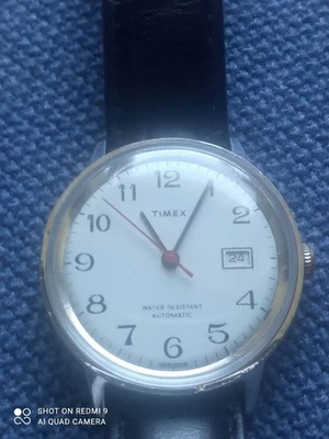 VINTAGE TIMEX 1976 AUTOMATIC MECHANICAL MEN'S SILVER LEATHER WATCH - image 1 of 4