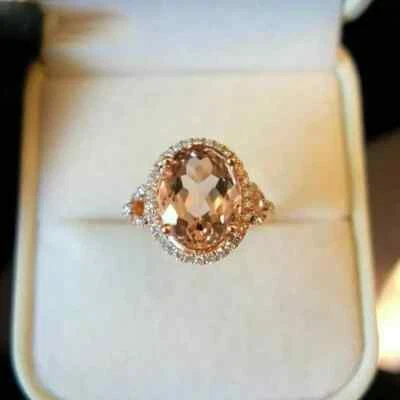 Anillo de compromiso con halo de morganita simulado de corte ovalado de 2,50 quilates enchapado en oro rosa de 14 quilates Foto 1 de 4