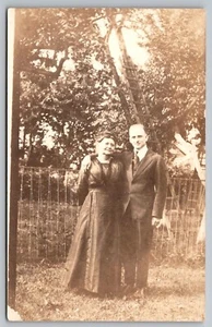 Postcard: Portrait of Couple in Front of Orchard, RPPC, 1904-1918, Unposted - Picture 1 of 2