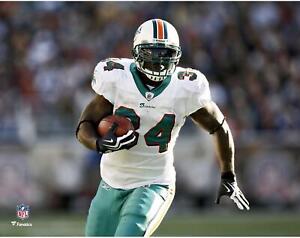 Ricky Williams Miami Dolphins Unsigned White Jersey Running Photograph