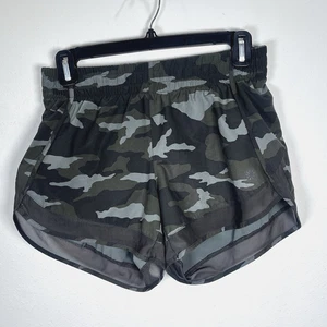 Athleta Racer Laufshorts bedruckt 4" grün Tarnmuster gefüttert sportlich Damen Gr. XS - Bild 1 von 8
