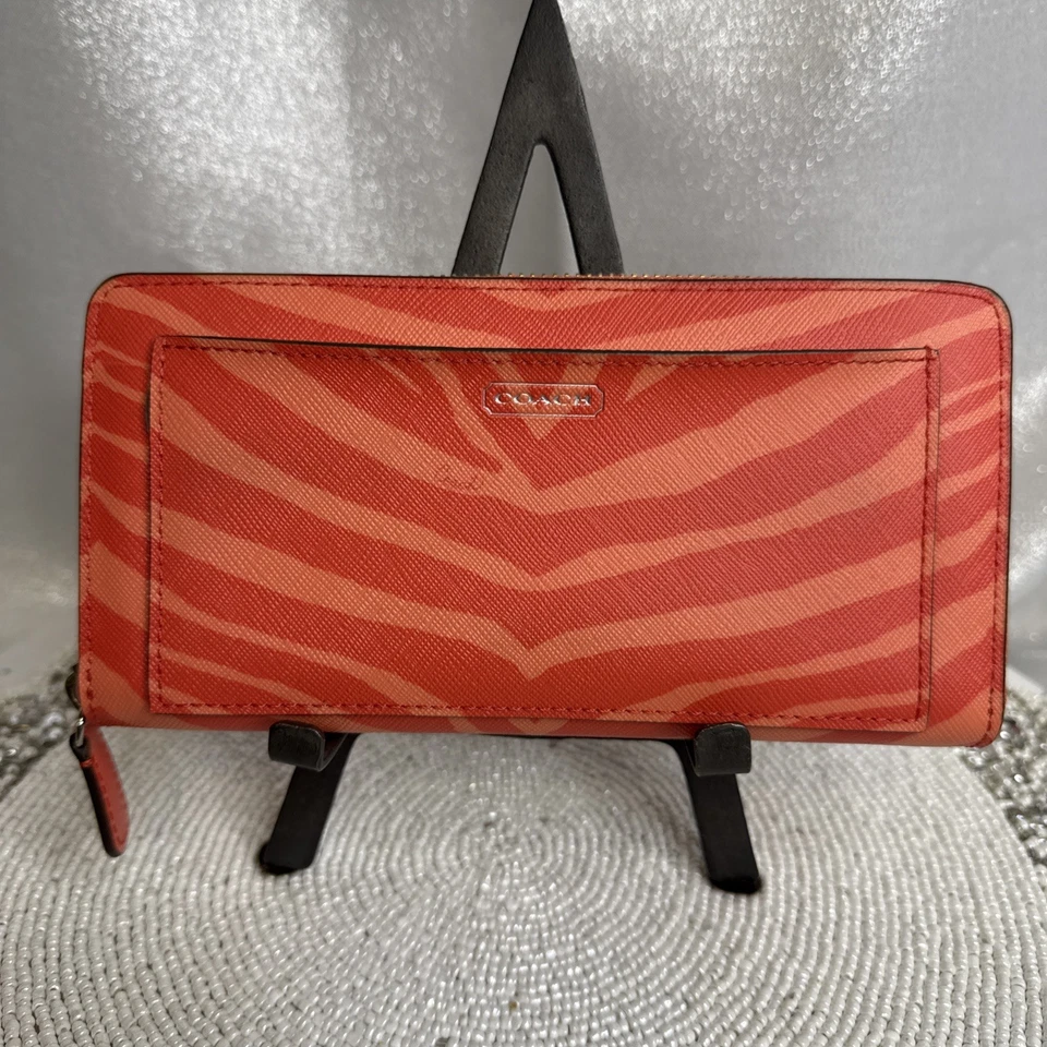 Acordeón de cuero Coach cremallera alrededor estampado de cebra naranja intenso nuevo con etiquetas Foto 1 de 4