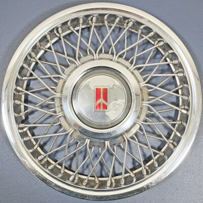 ONE 1987 年至 1990 年初 Oldsmobile Ciera # 4106A 14 英寸钢丝轮盖通用 10091786 — 第 1/4 张图片