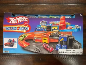 NEW SEALED Hot Wheels Ultra Hots Sto & Go Course ET Rangement Track Set w/ Cars - Picture 1 of 6
