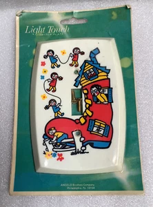 Zapato vintage Angelo Brothers interruptor de luz de plástico rima infantil mujer niños - Imagen 1 de 3