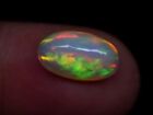 Naturalny opal etiopski 2,1 CT 12,x7,1 mm owalny ognisty luźny kamień szlachetny kaboszon