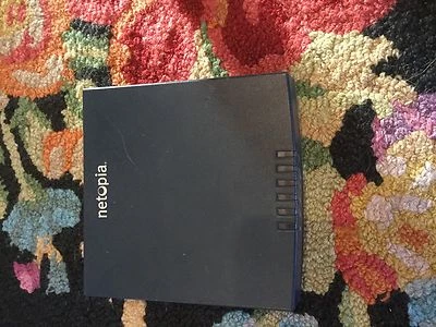 Netopia Cayman 3346N-002 4-Port 10/100 DSL Modem  USED - Image 1 of 3