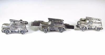 Gemelos plateados con camión de servicio RCA de Anson Foto 1 de 4