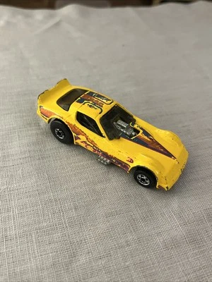 Coche divertido Mattel Hot Wheels Firebird 1977 - amarillo Goodyear Bell Champion Foto 1 de 4