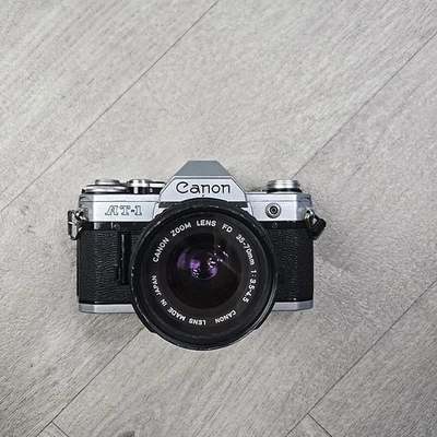 Cámara fotográfica Canon AT-1 35 mm SLR y lente de 35-70 mm COMO ESTÁ SIN PROBAR Foto 1 de 4
