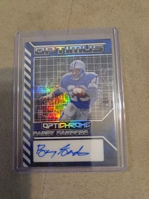 BARRY SANDERS 1/1 AUTO 2025 HOJA OPTICHROME OPTIMUS HOLO COLOR AZUL COINCIDE COMO NUEVO🔥 Foto 1 de 4