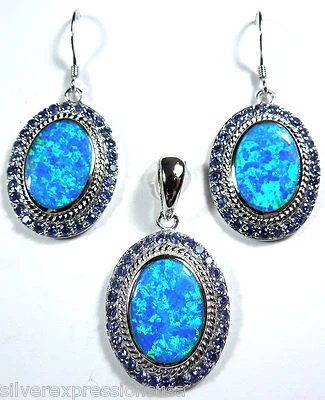 Conjunto de colgantes y pendientes de plata de ley 925 maciza con incrustaciones de tanzanita de ópalo de fuego azul Foto 1 de 4