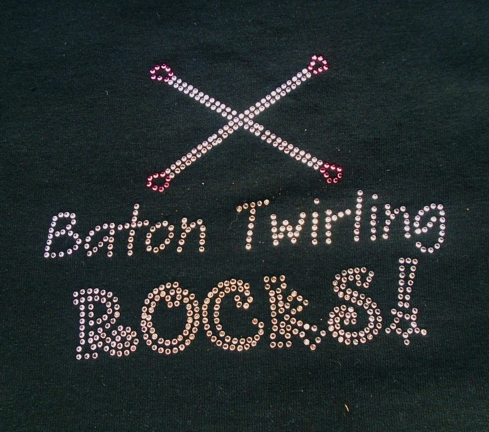 CAMISETA BATON TWIRLERS NEGRA TODAS LAS TALLAS BASTÓN GIRANDO ROCAS LETRAS ESTRÁS  Foto 1 de 1