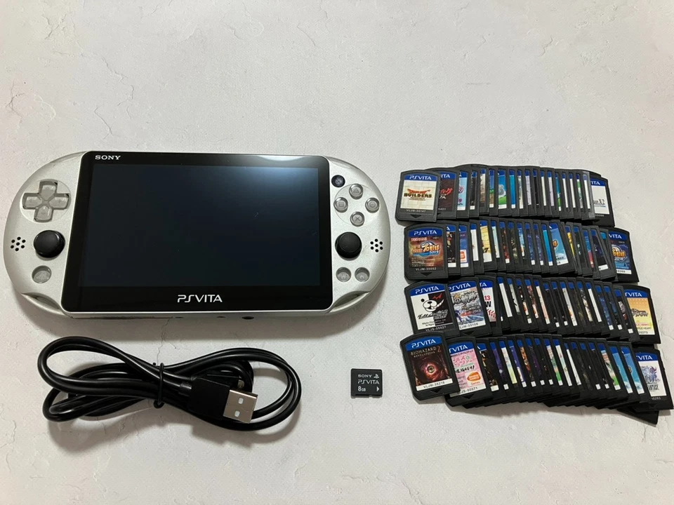 Sony PS Vita PCH-2000 Console with charger / Memory card random 2 games from US - Image 1 of 4
