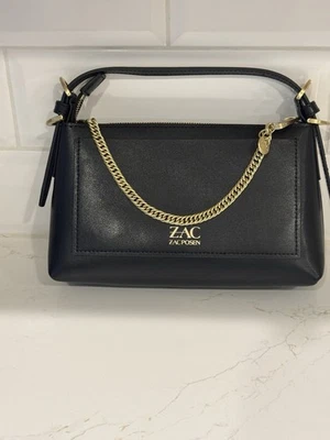 Bolso de mano pequeño Zac Posen negro con cadena dorada Foto 1 de 4