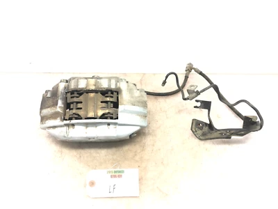 Pinza de freno delantera izquierda Infiniti Q70L M37 M56 2011-2019 con pastillas OEM Foto 1 de 4