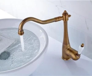 Grifo mezclador de caño giratorio de latón antiguo montado en cubierta para baño cocina - Imagen 1 de 7