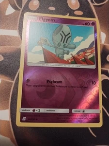 Elgyem 90/236 Sm-Unified Minds Reverse Holo-NM - Picture 1 of 2